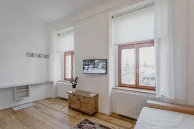 a white room with a table and a window at Apartmán 3, Suvorovova 158 in Český Brod