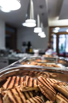 a bunch of waffles on a tray on a table at Penzion Palouček in Prague