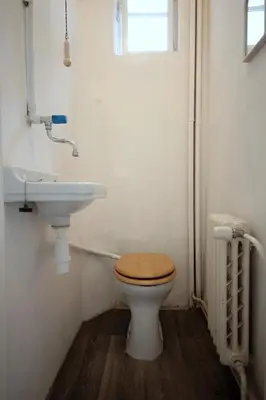 a white sink in a bathroom with a mirror at Sekaninova 52 Retro Flat in Prague