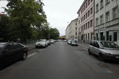 a street with cars parked on the side of the road at Sekaninova 52 Retro Flat in Prague