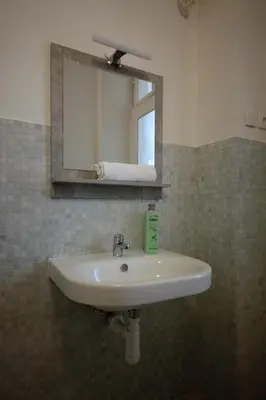 a washing machine in a bathroom with a shower at Sekaninova 52 Retro Flat in Prague