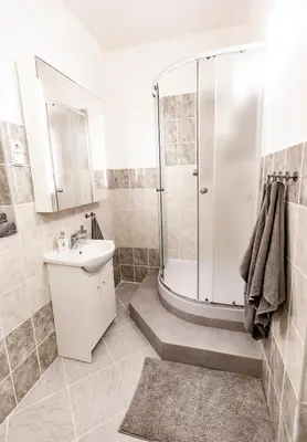 a bathroom with a shower and a sink at Prague Castle Garden Apartment in Prague