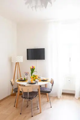 a dining room with a table with fruit on it at Prague Castle Garden Apartment in Prague