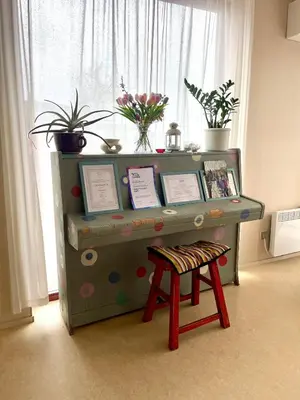 a desk with a stool in front of a window at Výhledna in Beroun