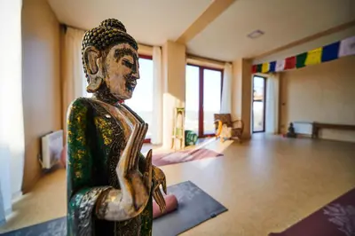 a statue sitting in a room next to a room with a room at Výhledna in Beroun