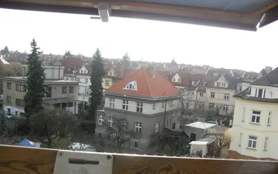 a view of a city with houses and buildings at Pension Hanspaulka in Prague