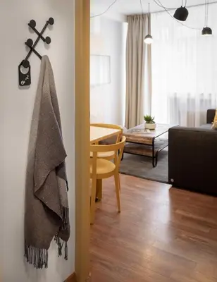 a hallway of a store with a door open at City Leaf Apartments in Prague