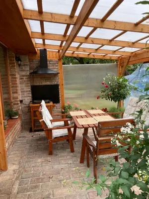 a living room with a couch and a table at Tradiční český dům s ložnicemi v podkroví in Všejany