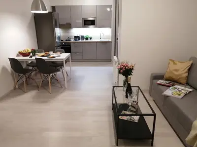 a living room with a couch and a table at Prima Family Apartments in Prague