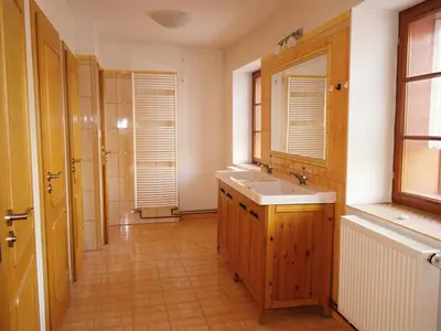 a bathroom with a sink and a mirror at Žabonosy Mlýn in Žabonosy