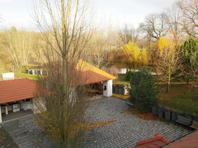an overhead view of a house with a tree and a courtyard at Žabonosy Mlýn in Žabonosy