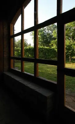 an open window with a view of a field at Ubytování na statku in Vědomice