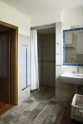 a bathroom with a sink and a mirror at Ubytování na statku in Vědomice