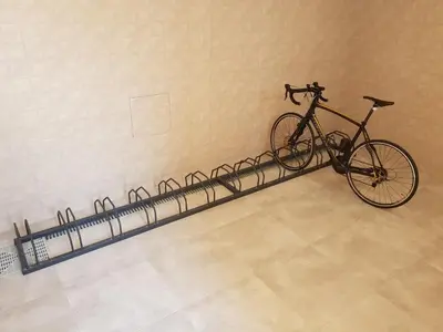 a bike parked in a room with a bike rack at Penzion Hudebka in Louny