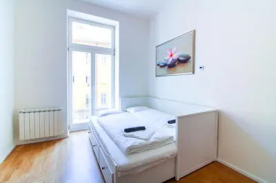 a room with a bed and a window at Bouquet Apartments in Prague