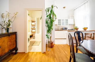a kitchen and a dining room with a table at Luxurious Kafka family apt in Old Town in Prague