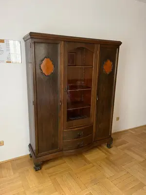 a wooden cabinet sitting on top of a wooden floor at Residence u Vejvodů in Prague