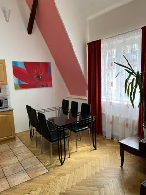 a dining room with a table and chairs at Residence u Vejvodů in Prague