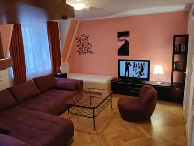 a living room with a couch and a tv at Residence u Vejvodů in Prague