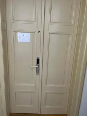 a white door with a sign on it at Residence u Vejvodů in Prague