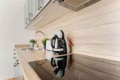 a coffee maker on a counter in a kitchen at New & cozy 3Bds in Historical Center - S8 in Prague