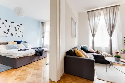 a living room with a bed and a couch at New & cozy 3Bds in Historical Center - S8 in Prague
