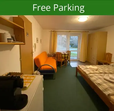 a hotel room with a bed and a free parking at Apartment Trojska in Prague
