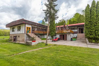 a large house with a large yard with a yard at Kemp Andělská laguna Slapy in Nalžovice
