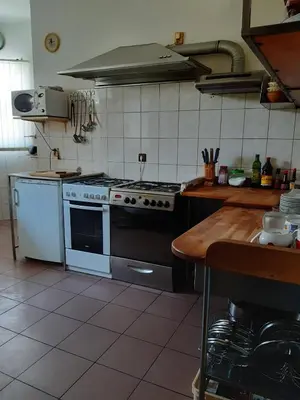 a kitchen with a stove and a counter in it at Penzion Cerhenice in Cerhenice