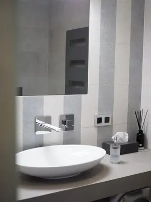 a hotel room with a desk and a chair at Apartman Grey in Prague