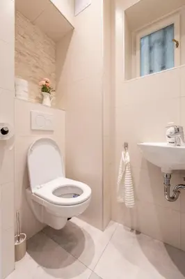 a bathroom with a toilet and a sink at Apartment Slavikova 11 in Prague
