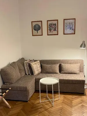 a living room with a couch and a table at Apartment Slavikova 11 in Prague