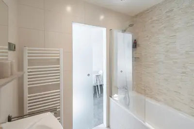 a bathroom with a shower and a toilet and a sink at Apartment Slavikova 11 in Prague