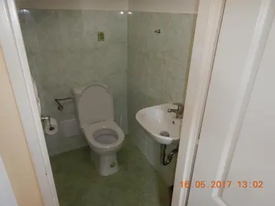 a small bathroom with a toilet and a sink at Farma Zahradnice in Olbramovice Ves