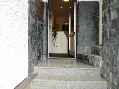 a hallway of a house with a brick wall at Penzion Pohoda Beroun in Beroun