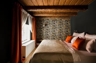 a bedroom with a bed and a window at Hotel Nerudova 211 in Prague