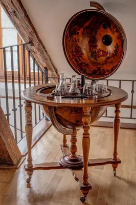 a table with glasses on top of it in a room at Hotel Nerudova 211 in Prague