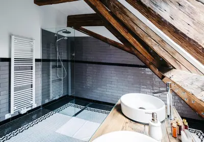 a bathroom with a sink and a shower at Boutique hotel Corso in Řevnice