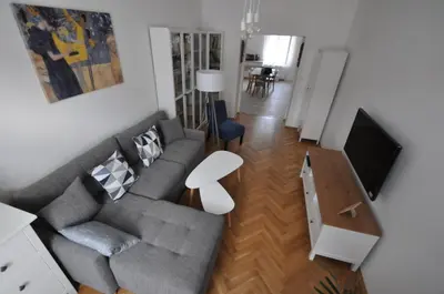 a living room with a couch and a table at Jiřina Appartments in Prague