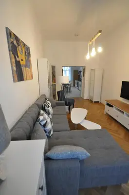 a living room with a couch and a table at Jiřina Appartments in Prague