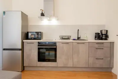 a microwave oven sitting on top of a counter at Stay Inn Apartments Stepanska in Prague