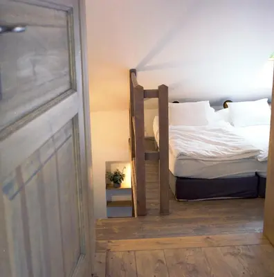 a bedroom with a bunk bed and a door at Penzion Venkoff in Sázava