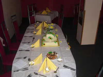 a long table with a cake on top of it at Penzion U Kašných in Mníšek pod Brdy