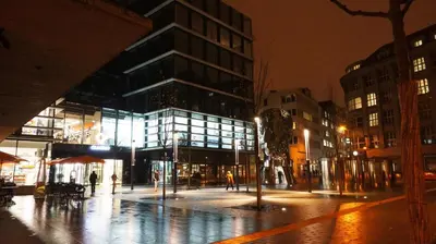 a city street at night with a large building at Naru house 9 in Prague