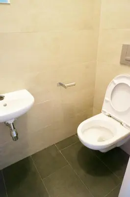 a bathroom with a toilet and a sink at Naru house 9 in Prague