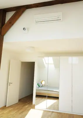 a room with white walls and a vaulted ceiling at Naru house 9 in Prague