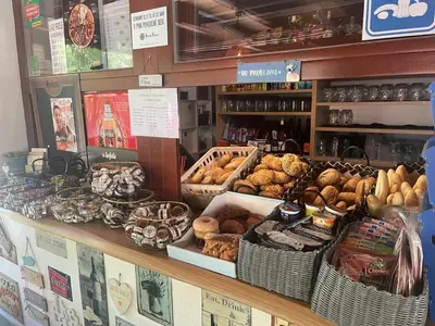 a bakery with a bunch of different types of bread at Camping Matyáš in Vrané nad Vltavou