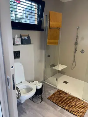 a bathroom with a toilet and a shower at Camping Matyáš in Vrané nad Vltavou