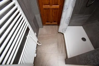 an overhead view of a stairs with a white radiator at Wow Wow Apartment in Prague