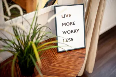 a sign sitting on a table next to a plant at Wow Wow Apartment in Prague